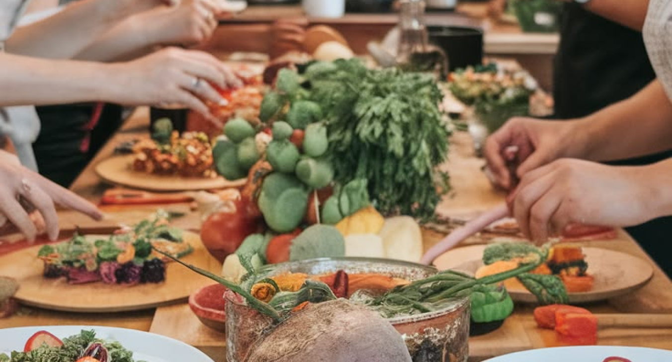 Warm hands preparing food together at a shared table